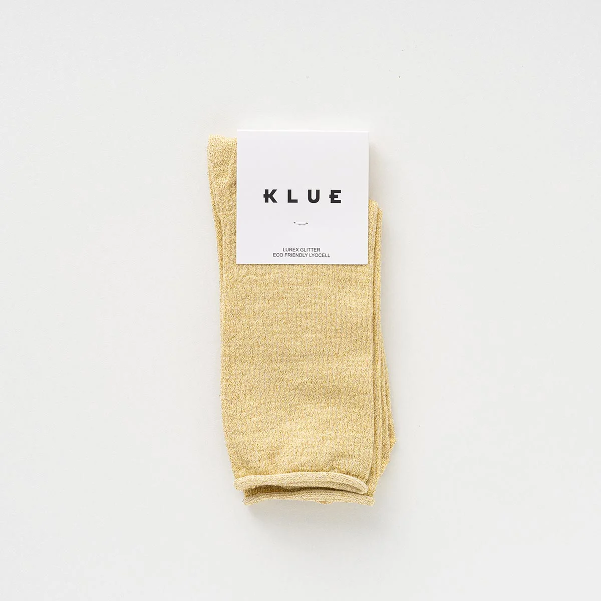 Zitronengelbe KLUE Glitzersocken Lemon aus Lyocell mit feinem Metallic-Schimmer und umgeschlagenem Abschluss.