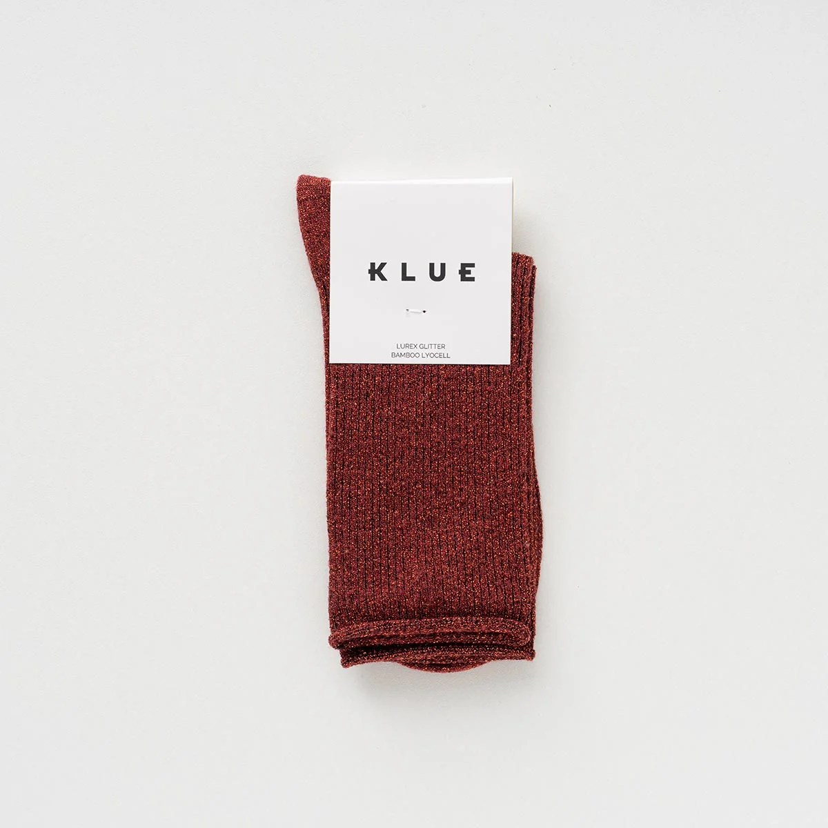 Rote KLUE Glitzersocken aus Lyocell mit feinem Metallic-Schimmer und umgeschlagenem Abschluss in Größe 36–40.